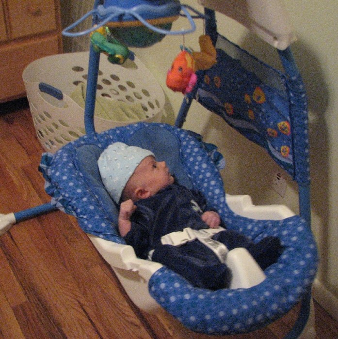 His new swing.  Rock on!
